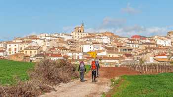 Pilgrims entering the Spanish town of Cirauqui on the Camino