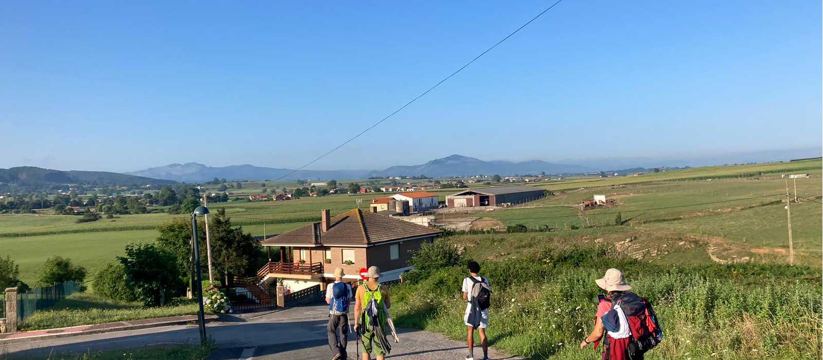 Hikers on the Camino del Norte walking into Comillas | Lachlan Baker