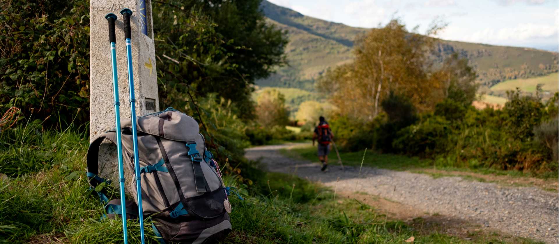 Backpack and walking poles on the Camino