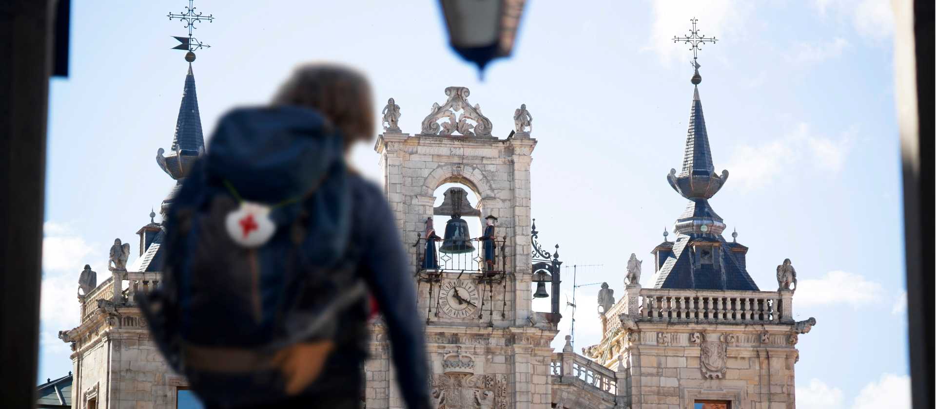 A pilgrim reaches the main square in Leon, Spain, on the Camino