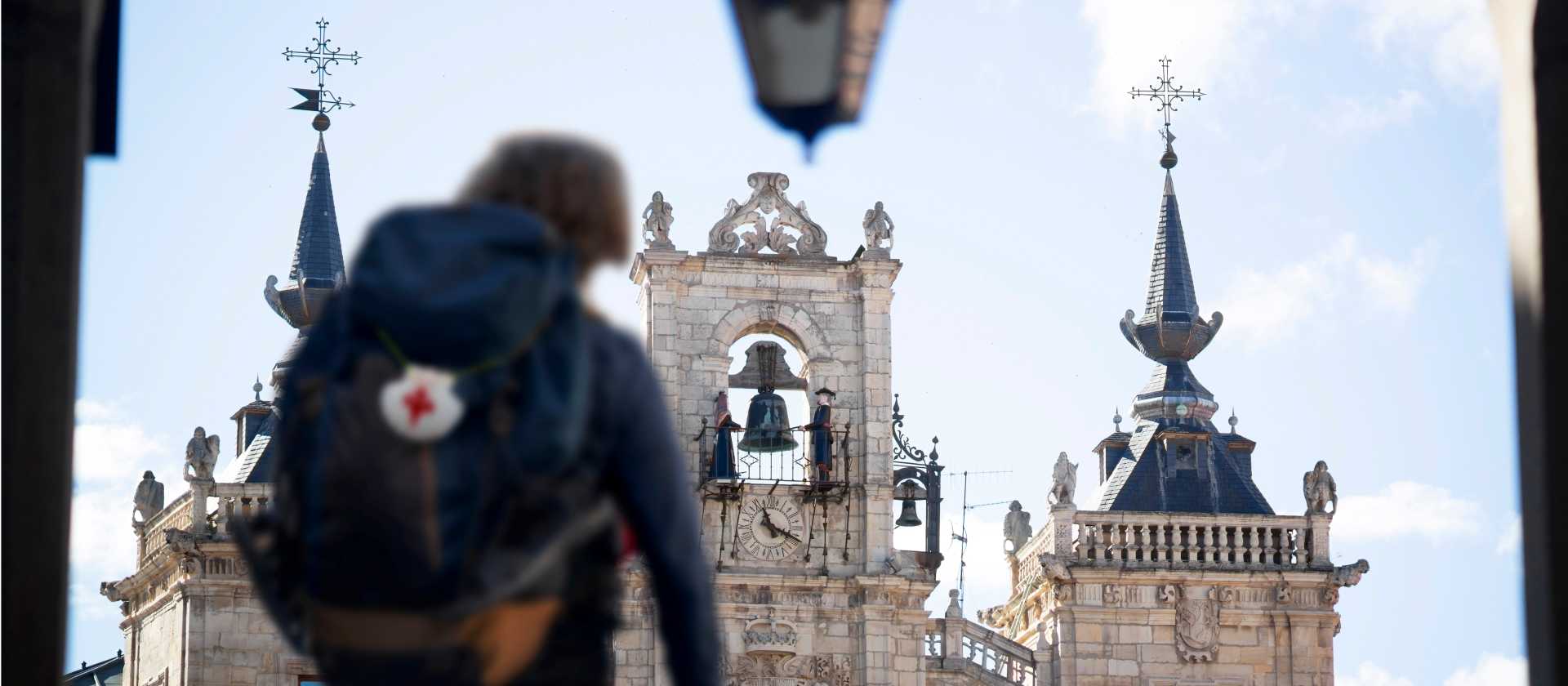 A pilgrim reaches the main square in Leon, Spain, on the Camino