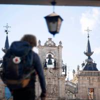 A pilgrim reaches the main square in Leon, Spain, on the Camino