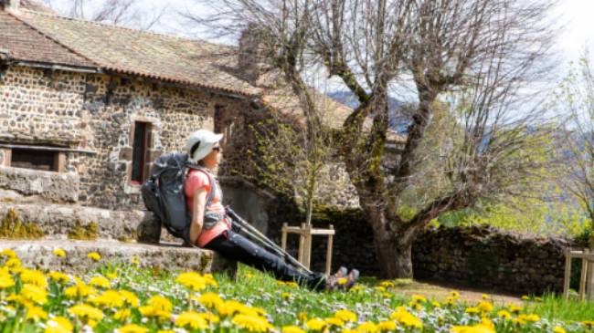 A pilgrim rests near Aubrac on the Le Puy Camino in France