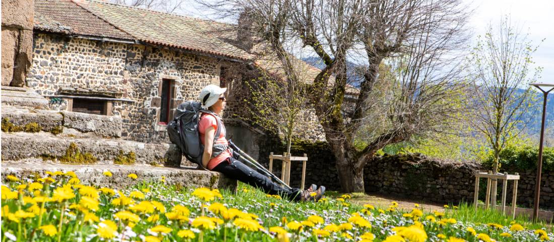 A pilgrim rests near Aubrac on the Le Puy Camino in France