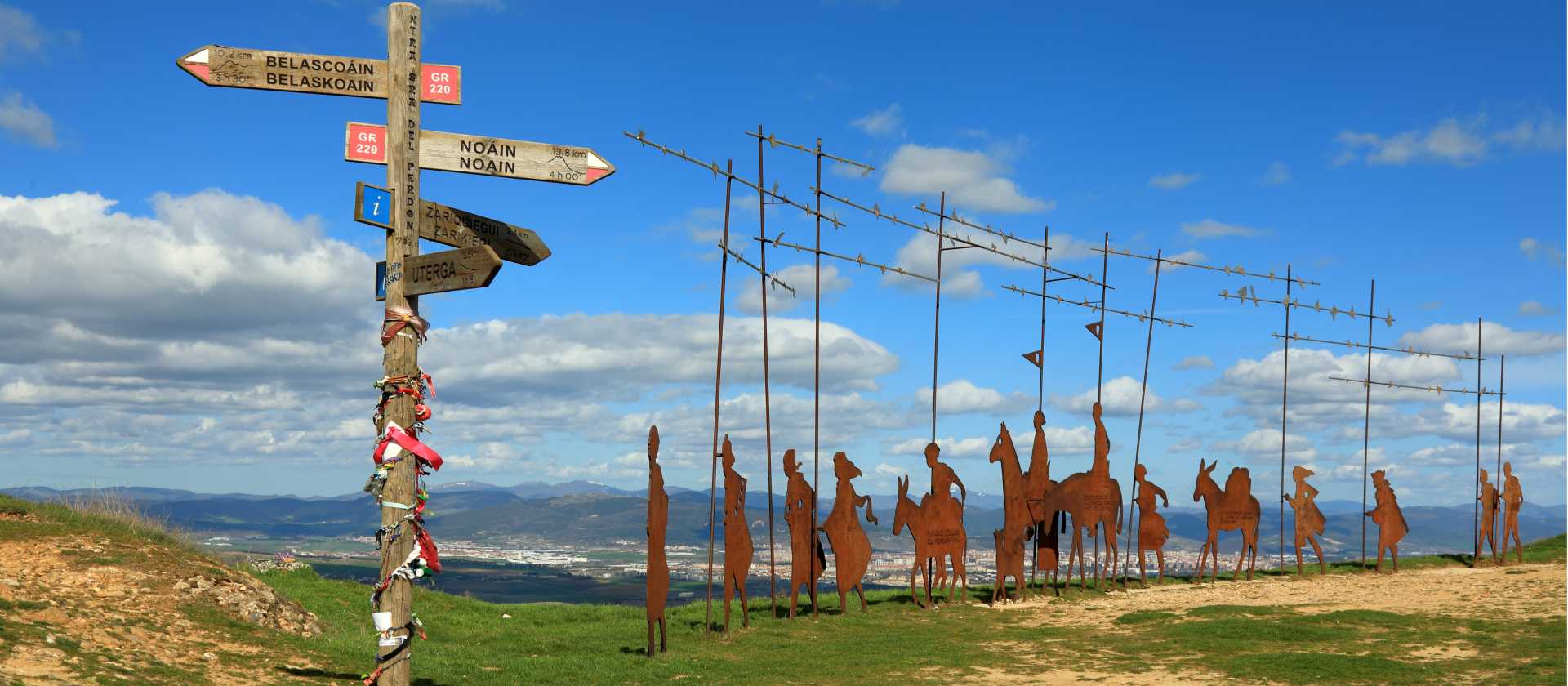 Find the iconic Alto del Perdon Camino art near Pamplona