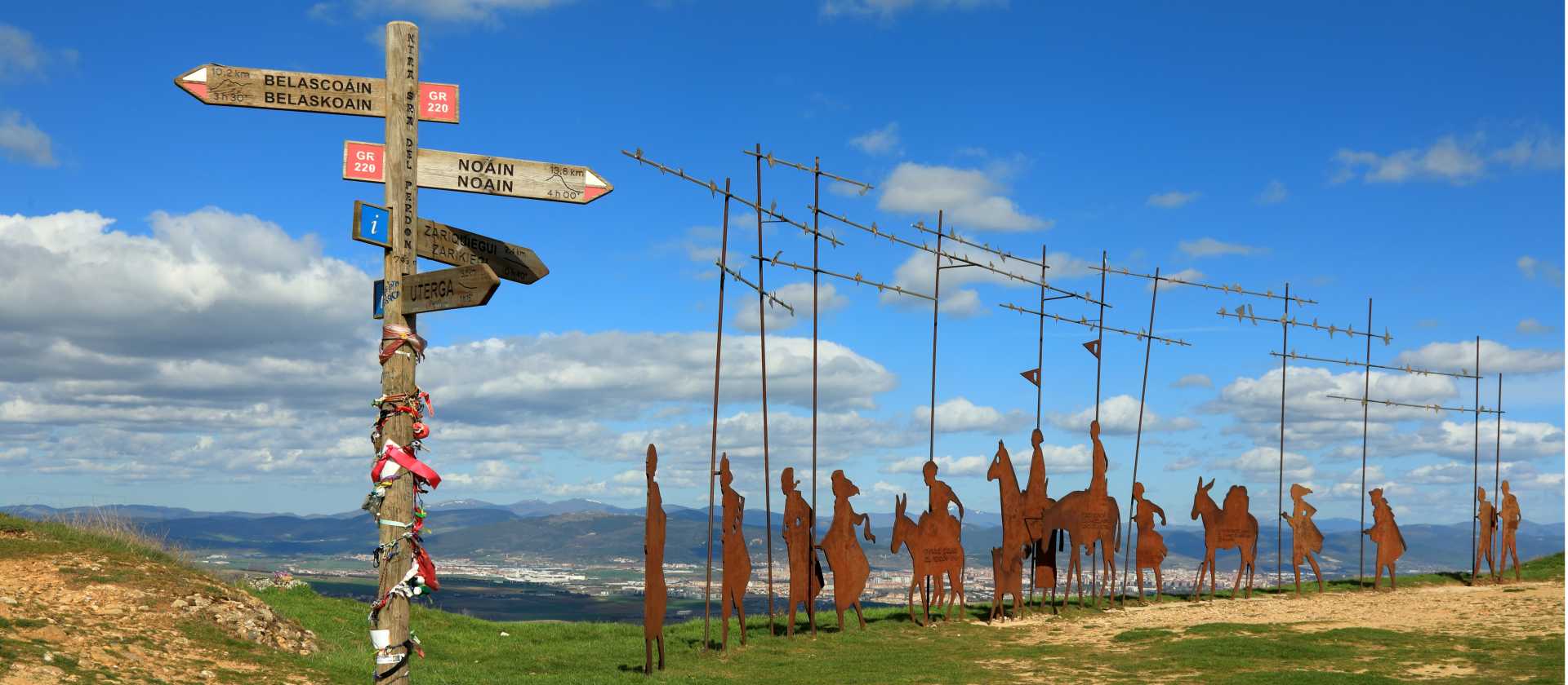 Find the iconic Alto del Perdon Camino art near Pamplona