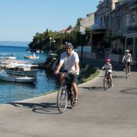 Cycling past boats on the Croatian islands with kids | Ross Baker