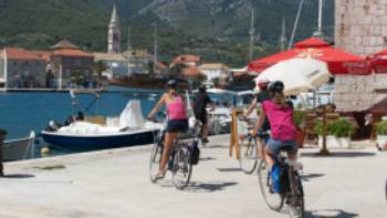 Children cycling into the town of Jelsa on the island of Hvar