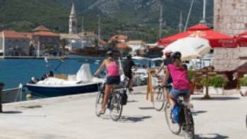 Croatia Dalmation Coast 236,Ross Baker Children cycling into the town of Jelsa on the island of Hvar