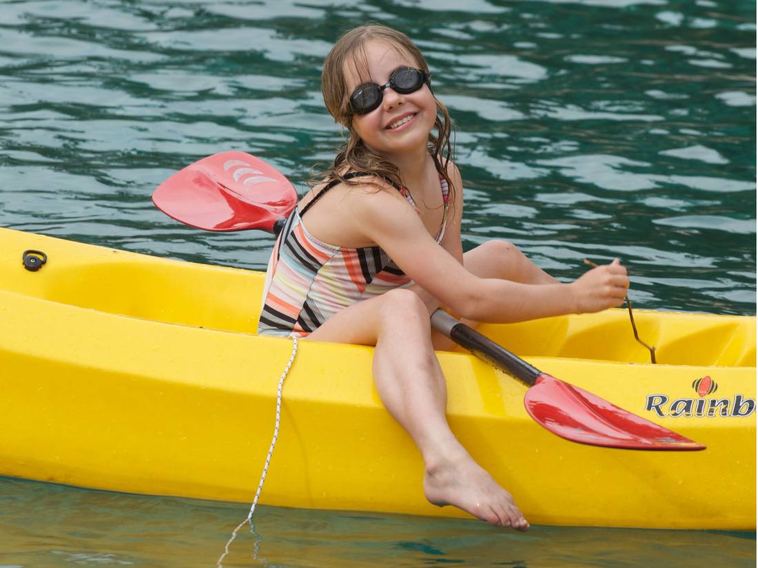 Child kayaking off the boat in the Mediterranean |  <i>Ross Baker</i>