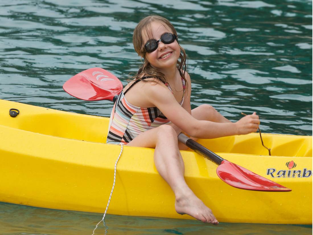 Child kayaking off the boat in the Mediterranean |  <i>Ross Baker</i>