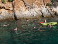Kids swimming and kayaking on a family adventure in the Mediterranean |  <i>Ross Baker</i>