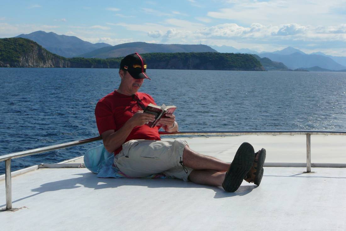 Relaxing with a book aboard boat Linda, Croatia