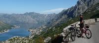 Cyclist pauses to admire the beauty of Kotor Bay, Montenegro