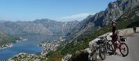 Cyclist pauses to admire the beauty of Kotor Bay, Montenegro