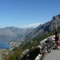 Cyclist pauses to admire the beauty of Kotor Bay, Montenegro