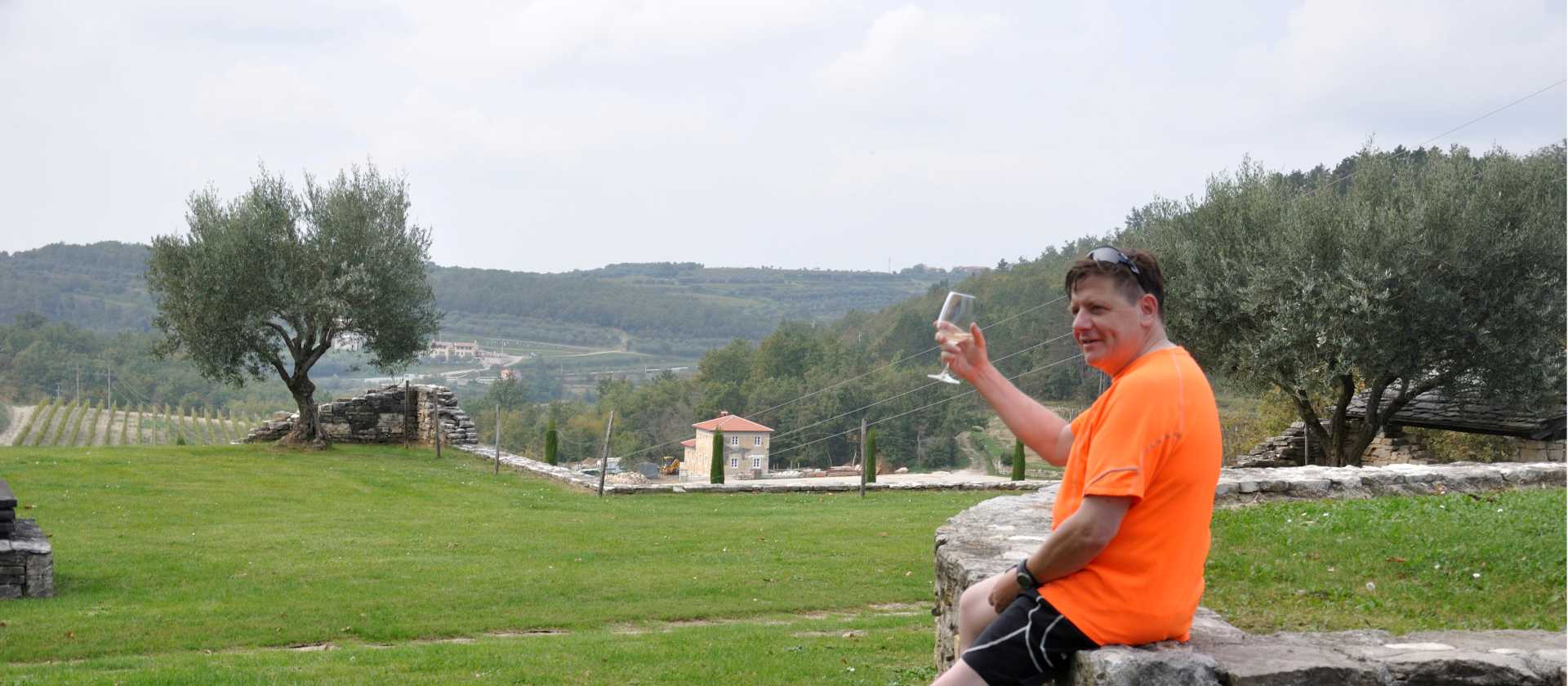 Cyclist enjoying a glass of wine in Istria
