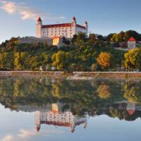 Bratislava castle with reflection in river Danube