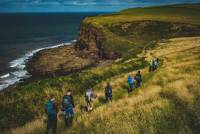 Walking single file along the green cliffs of England on the Coast to Coast |  <i>Tim Charody</i>