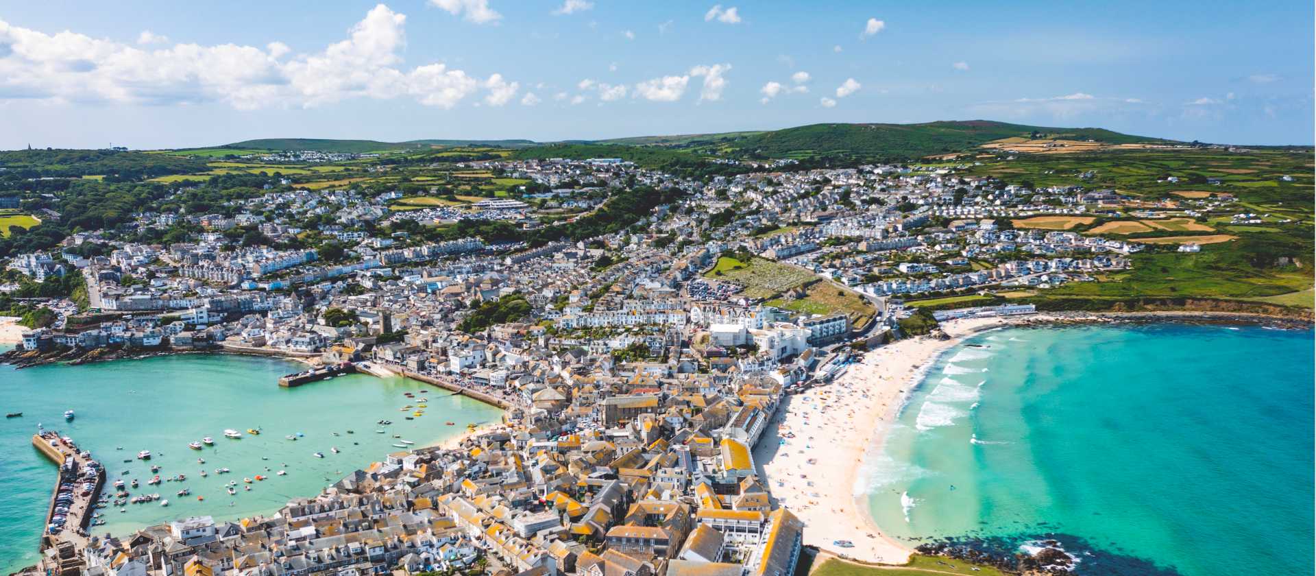 Porthmeor Beach and the town of St Ives in Cornwall. | Tim Charody