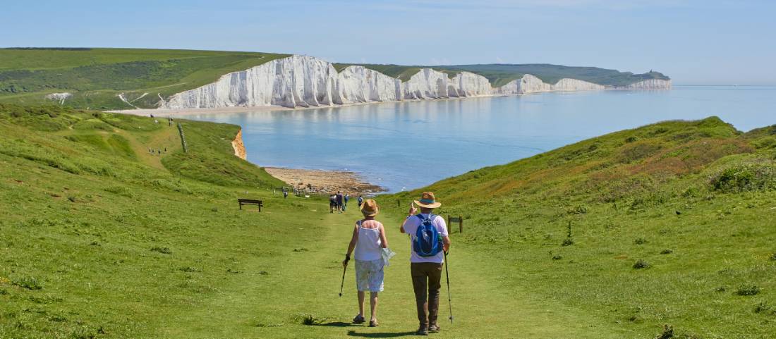 A couple walking towards the Seven Sisters on the South Downs Way |  <i>Marc Najera</i>