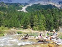 Rest stop with an impromptu foot soak in the Alps |  <i>Vincent Lamy</i>