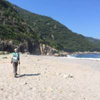 Walking on an empty beach in Corsica | Kate Baker