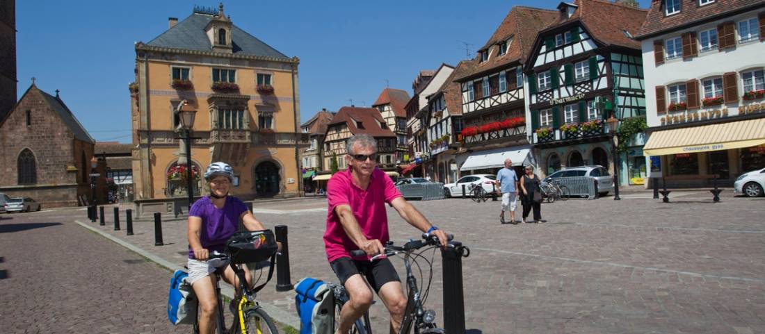 Cycling through a small village in Alsace