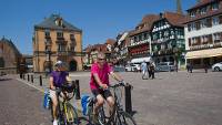 Cycling through a small village in Alsace