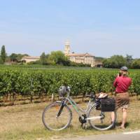 Cyclist stopping to take a photo in Bordeaux | Jaclyn Lofts