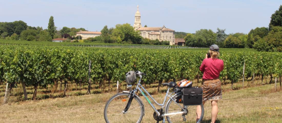 Cyclist stopping to take a photo in Bordeaux |  <i>Jaclyn Lofts</i>