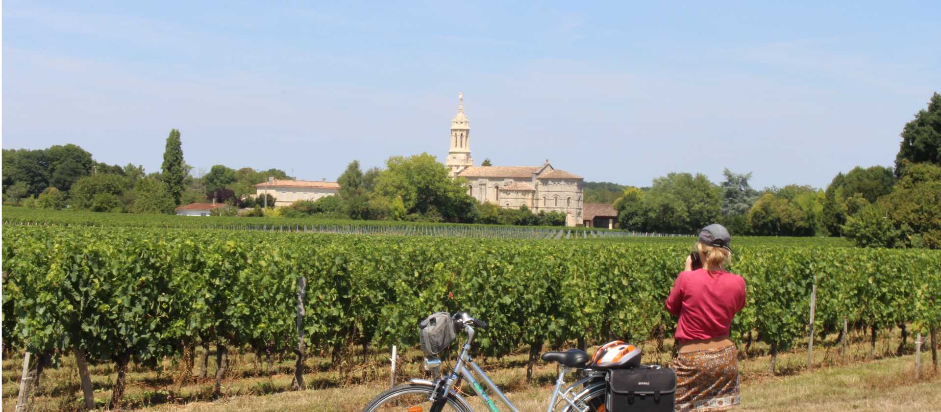 Cyclist stopping to take a photo in Bordeaux | Jaclyn Lofts