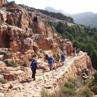 The sun shining down a group in mountainous Corsica | Paul Ensor