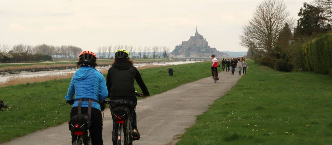 Cyclists and pedestrians en route to Mont St Michel in Normandy |  <i>Kate Baker</i>