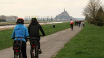 Cyclists and pedestrians en route to Mont St Michel,Kate Baker Cyclists and pedestrians en route to Mont St Michel