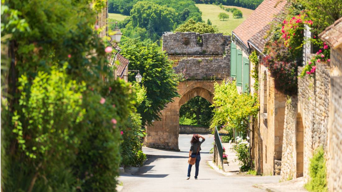 Old street of Domme village in Dordogne department, France