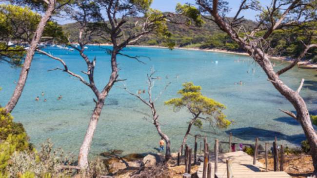 Enjoying secluded swims on a beach in Porquerolles island along the French Riviera