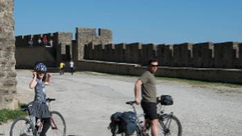Languedoc KB 313 (3),Kate Baker Cyclists on the ramparts of Carcassonne