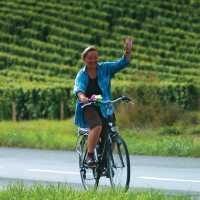 A local woman gives a welcoming wave, Loire Valley, France | Michael Gebicki