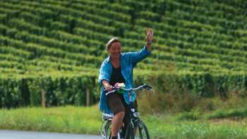 A local woman gives a welcoming wave, Loire Valley, France