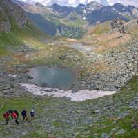 Group on the Tour de Monte Rosa Walk navigating a steep section | Andrew Bain