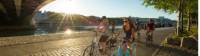 Cycling beneath one of the many bridges spanning the Rhone River in Lyon