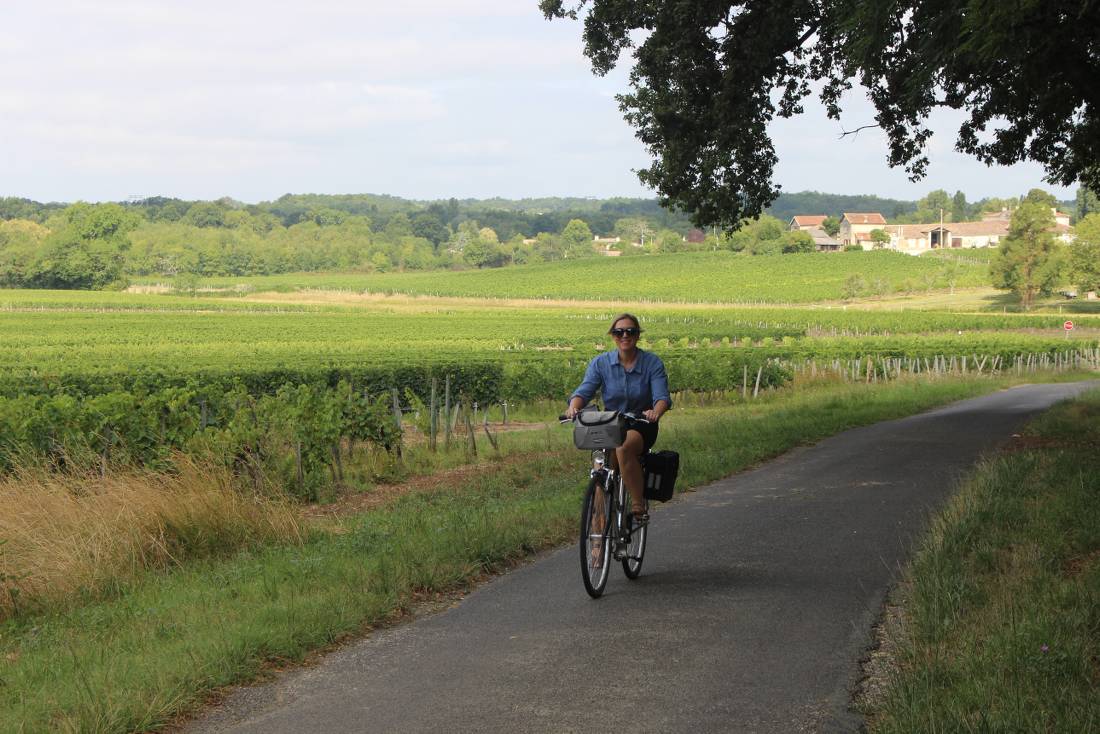 Cycling past vineyards in Bordeaux | <i>Jaclyn Lofts</i>