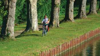 A local returning from the 'boulangerie' enjoys the view