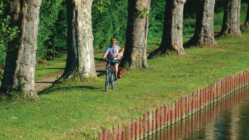 A local returning from the 'boulangerie' enjoys the view | Michael Gebicki