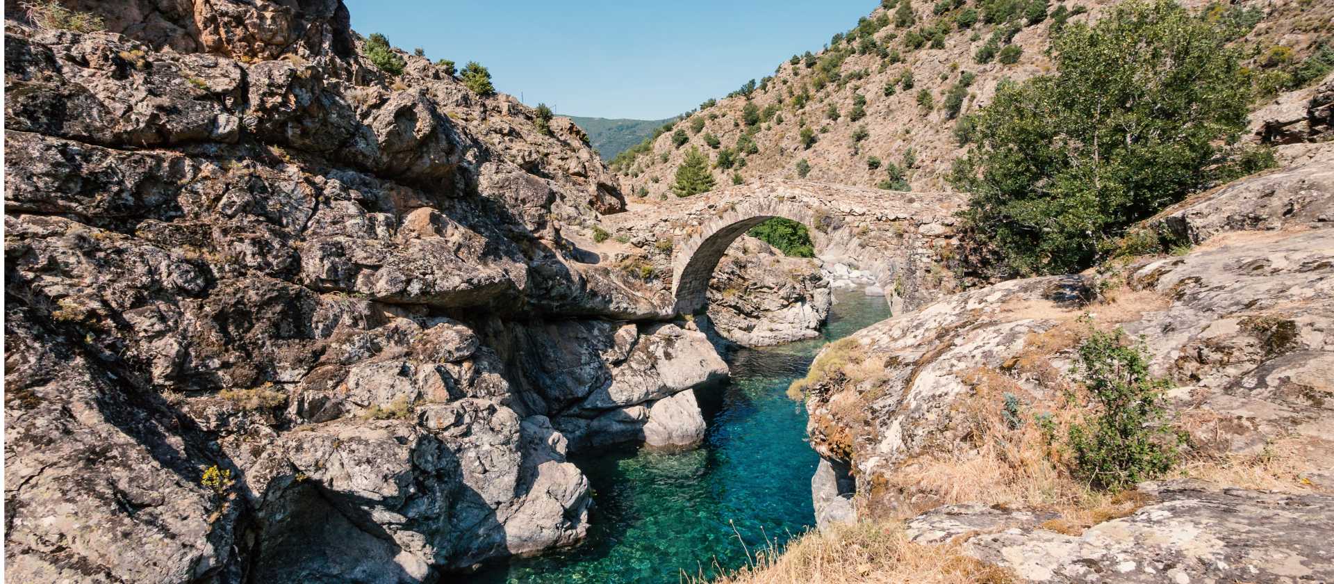 Ancient arched bridge on the GR20 in Corsica