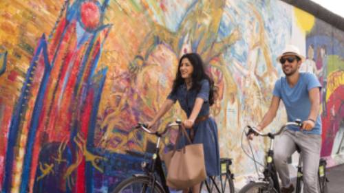 Cycling along Berlin's East Side Gallery | Philip Koschel