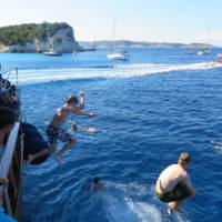 Kids jumping into the warm Ionian waters in Greece | Gordon Steer