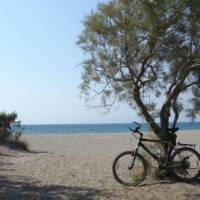 Taking a break from cycling at serene Kalavarda Beach in Greece