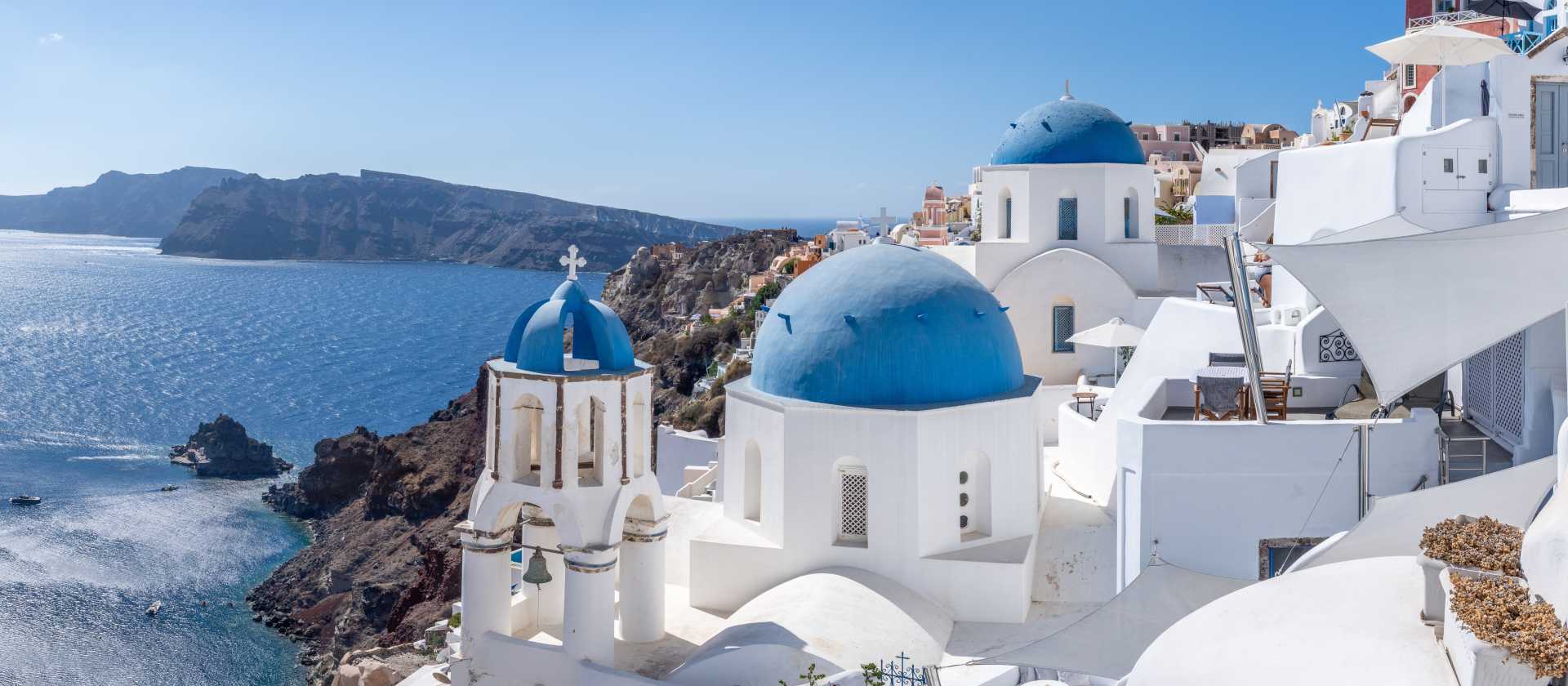 Experience the famous white-washed buildings and blue-domed churches of Santorini.